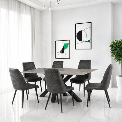 Modern dining table with grey quilted chairs in a bright room with white tile floor