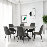 Modern dining table with grey quilted chairs in a bright room with white tile floor