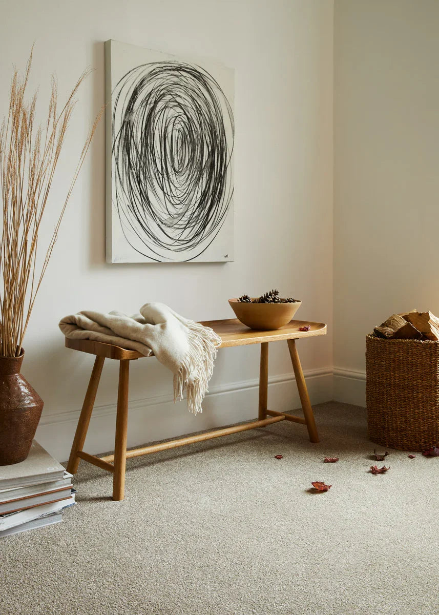 Inglewood Saxony carpet in neutral tone with wooden bench and minimalist decor