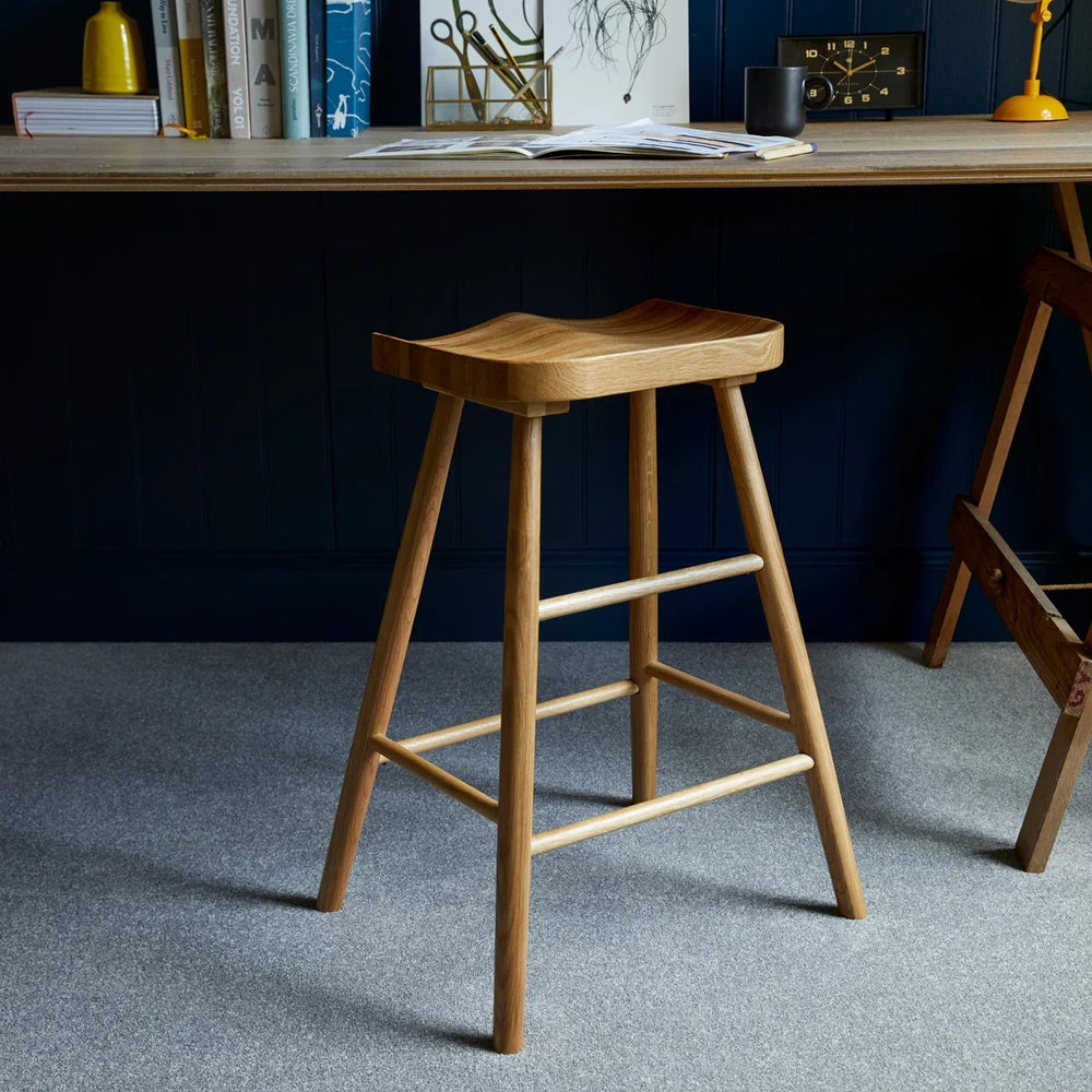 Apollo Plus Homer Ton Grey carpet in modern home office with wooden stool