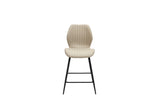 A modern bar stool with a ribbed beige upholstered seat and backrest, supported by slim black metal legs, shown against a plain white background.