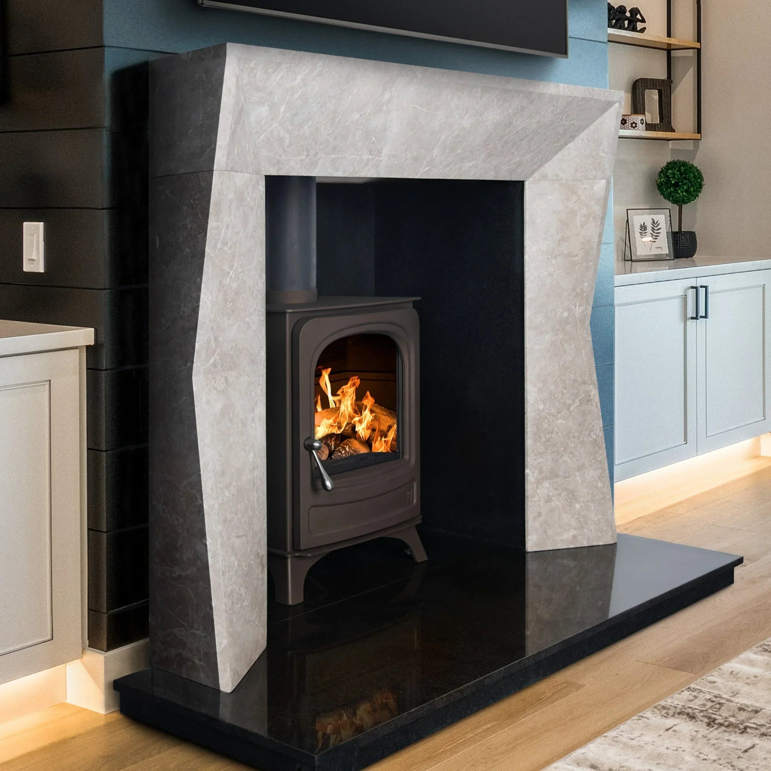 Modern grey stone fireplace surround with wood burning stove in a contemporary living room