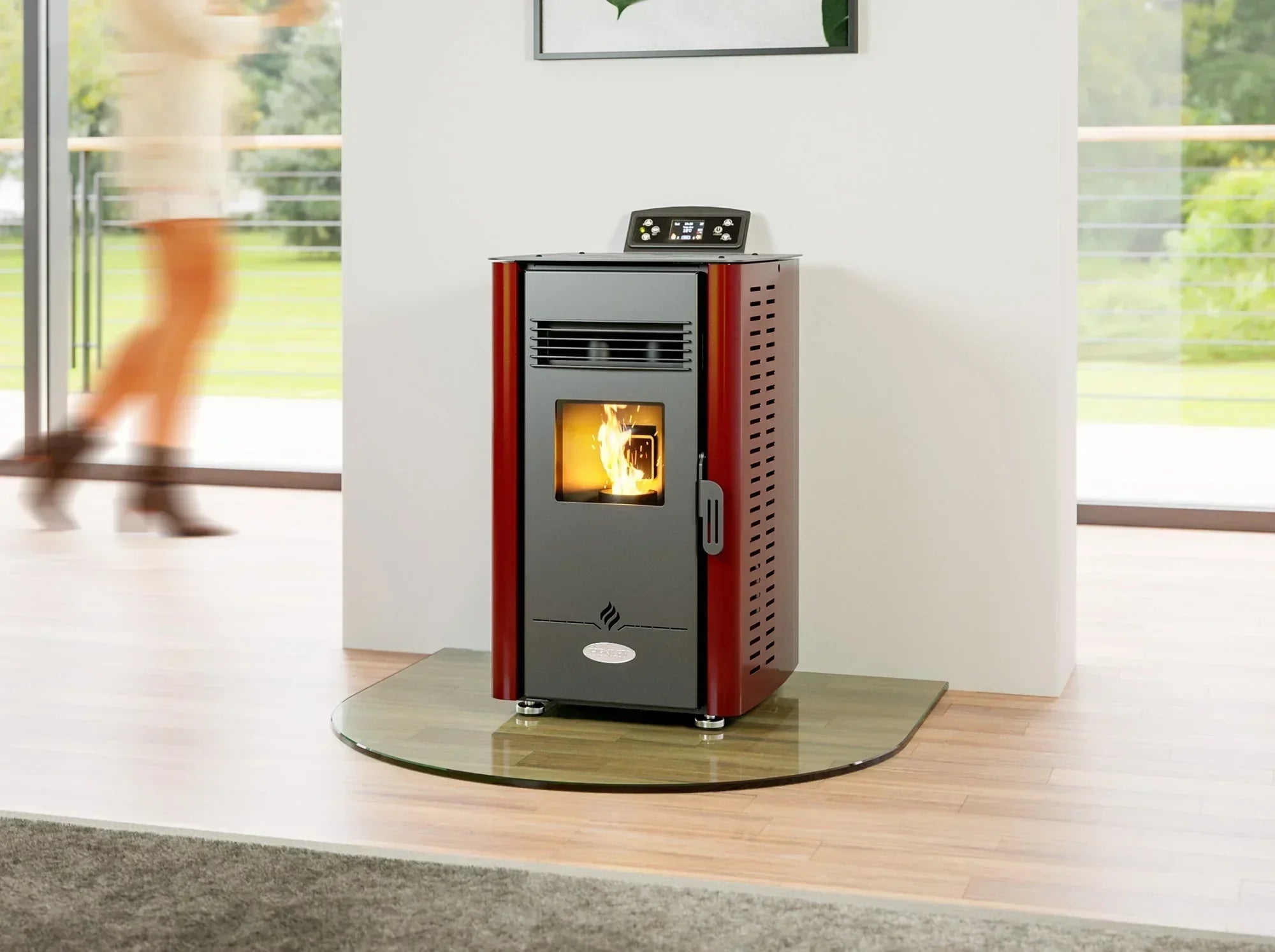 Red and black freestanding pellet stove with glass front in modern living room setting
