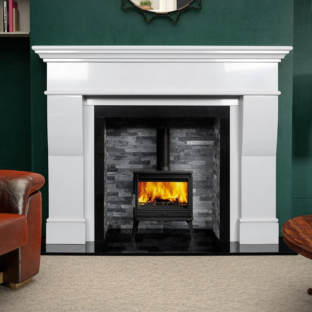 Polished polar white fireplace surround with black stove and grey stone insert
