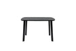 A minimalist black rectangular table with rounded corners and four tapered legs, shown against a plain white background.