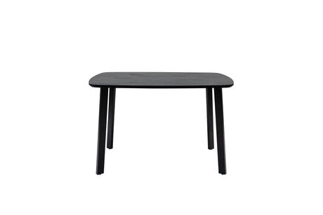 A minimalist black rectangular table with rounded corners and four tapered legs, shown against a plain white background.