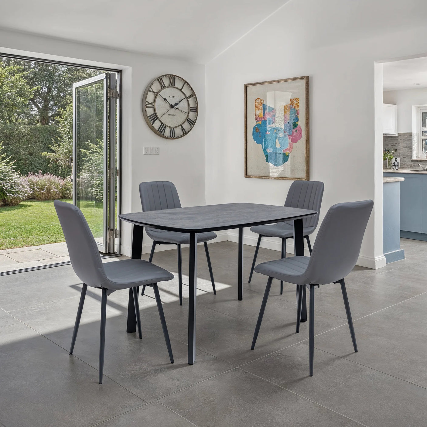 Dining area with a table and chairs in a modern home setting.