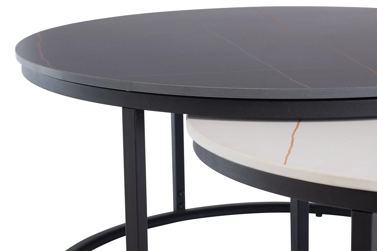 Close-up of black and white marble nesting coffee tables with metal frame