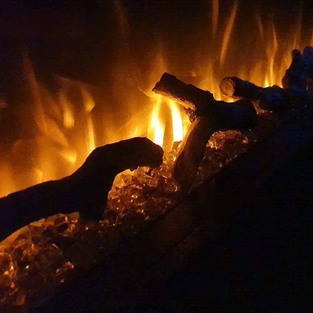 Electric fireplace flame effect with glowing artificial logs and crystal embers