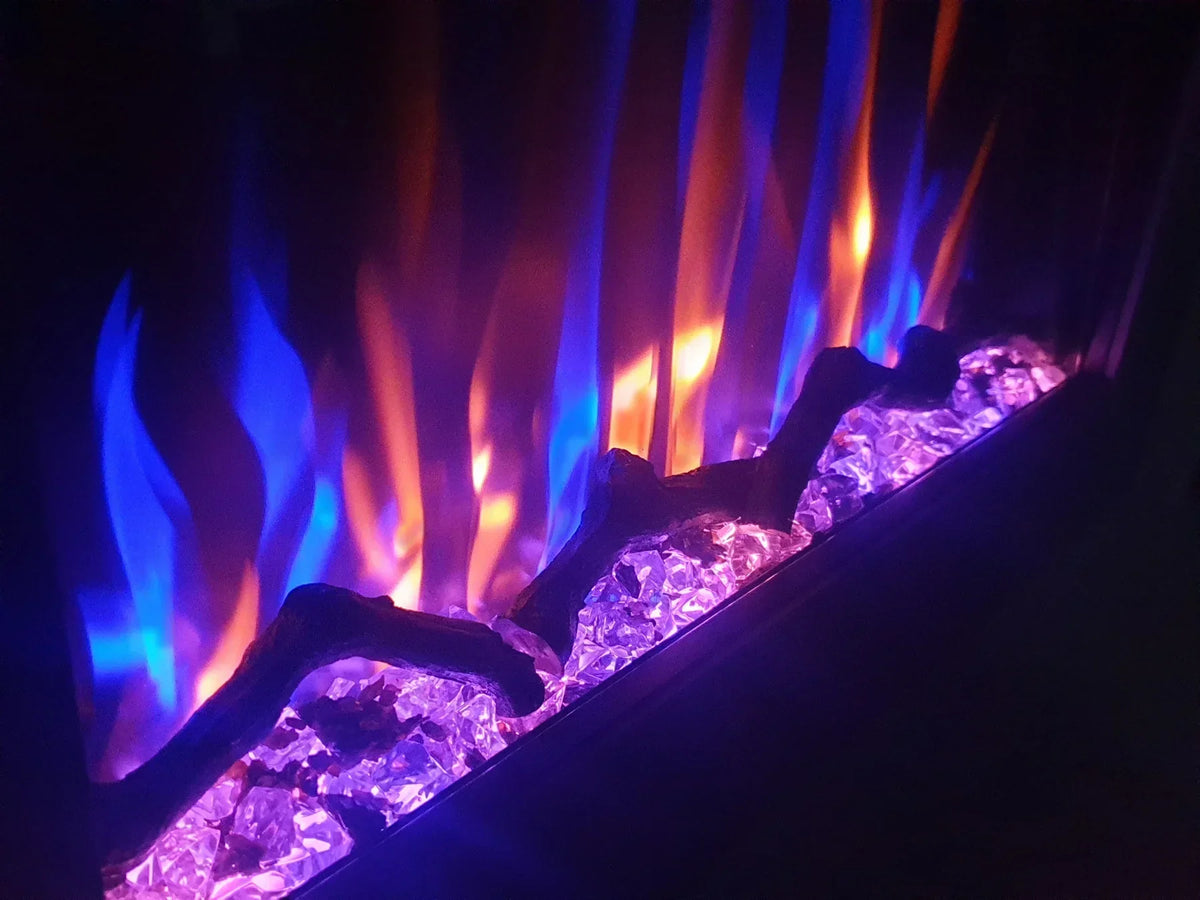 Electric fireplace close-up with blue and orange flame effect and crystal embers