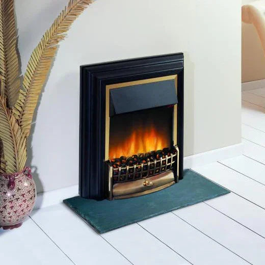 Freestanding electric fire with black and brass trim on white wooden floor in living room
