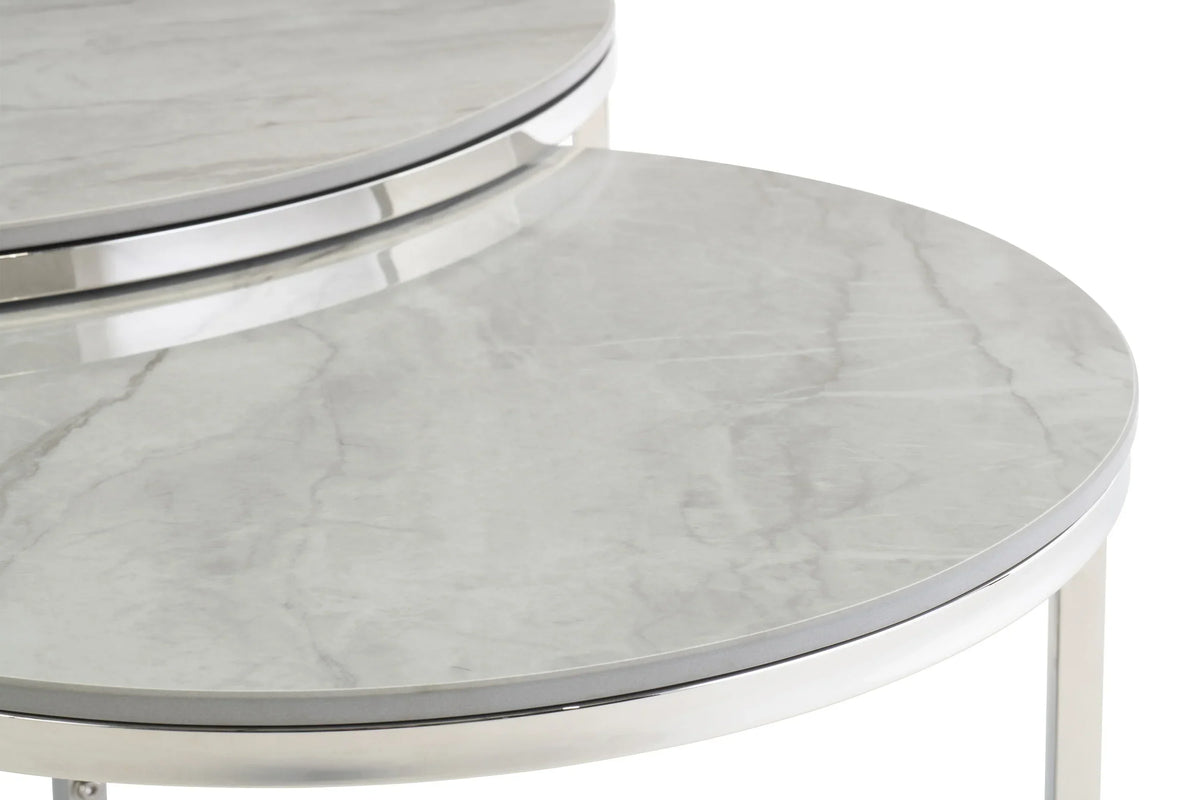 Close up of round marble nesting coffee table with chrome frame