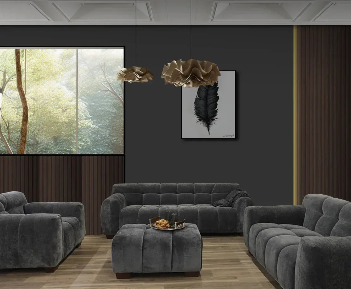 Grey velvet sofa set with matching ottoman in a modern living room with wood panel walls
