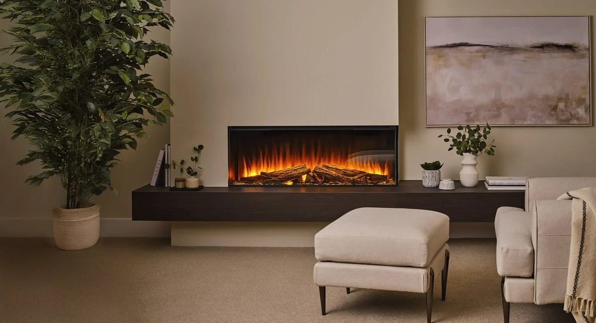 Electric fireplace with realistic log display in modern living room, beige armchair and plant