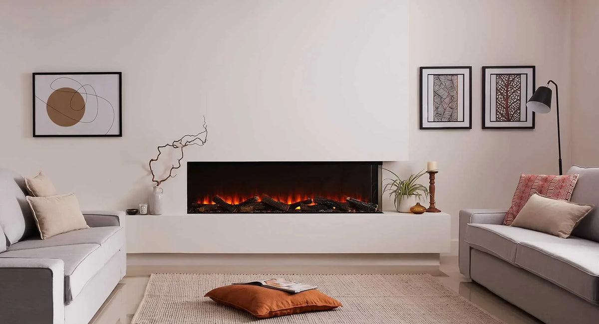 Modern living room with grey sofas, electric fireplace, wall art and decorative cushions