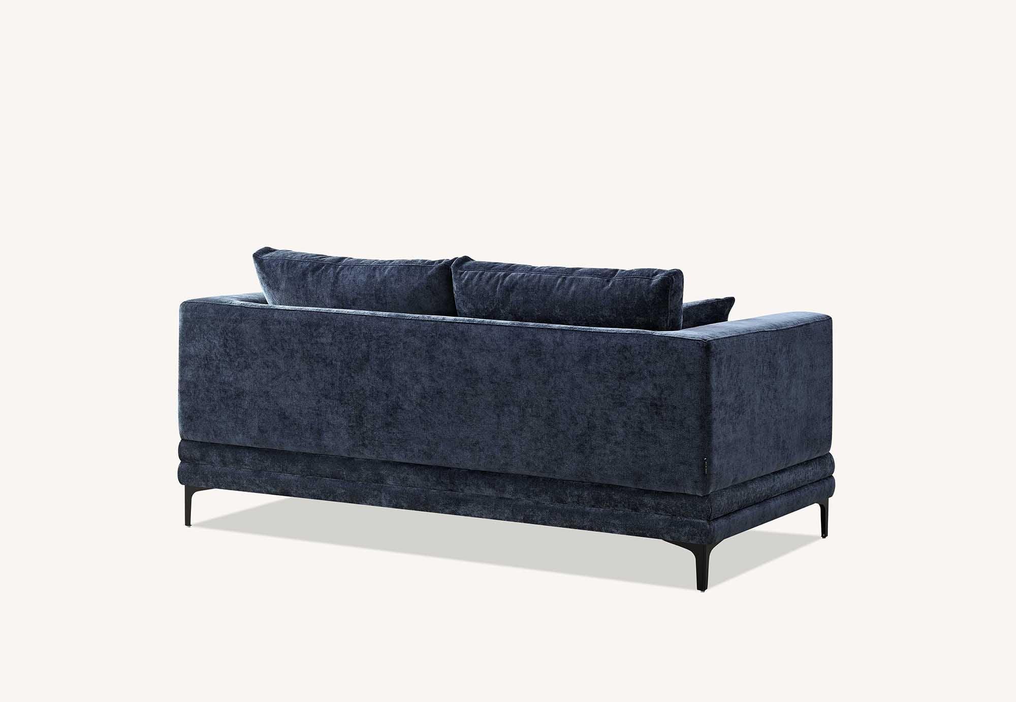 Velvet blue sofa rear view with slim metal legs and rectangular cushions