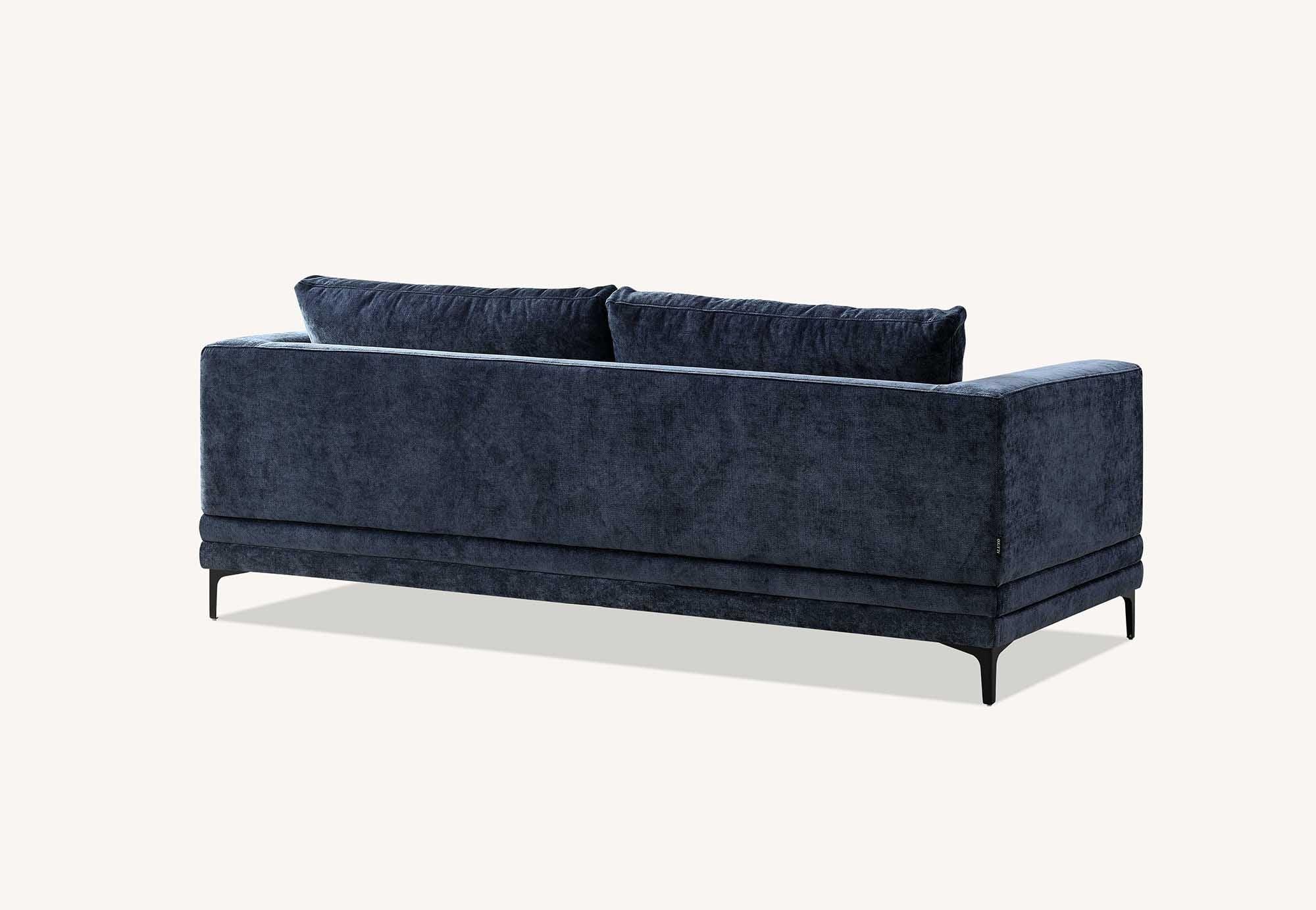 Blue fabric sofa with metal legs, rear view showing plush back cushions