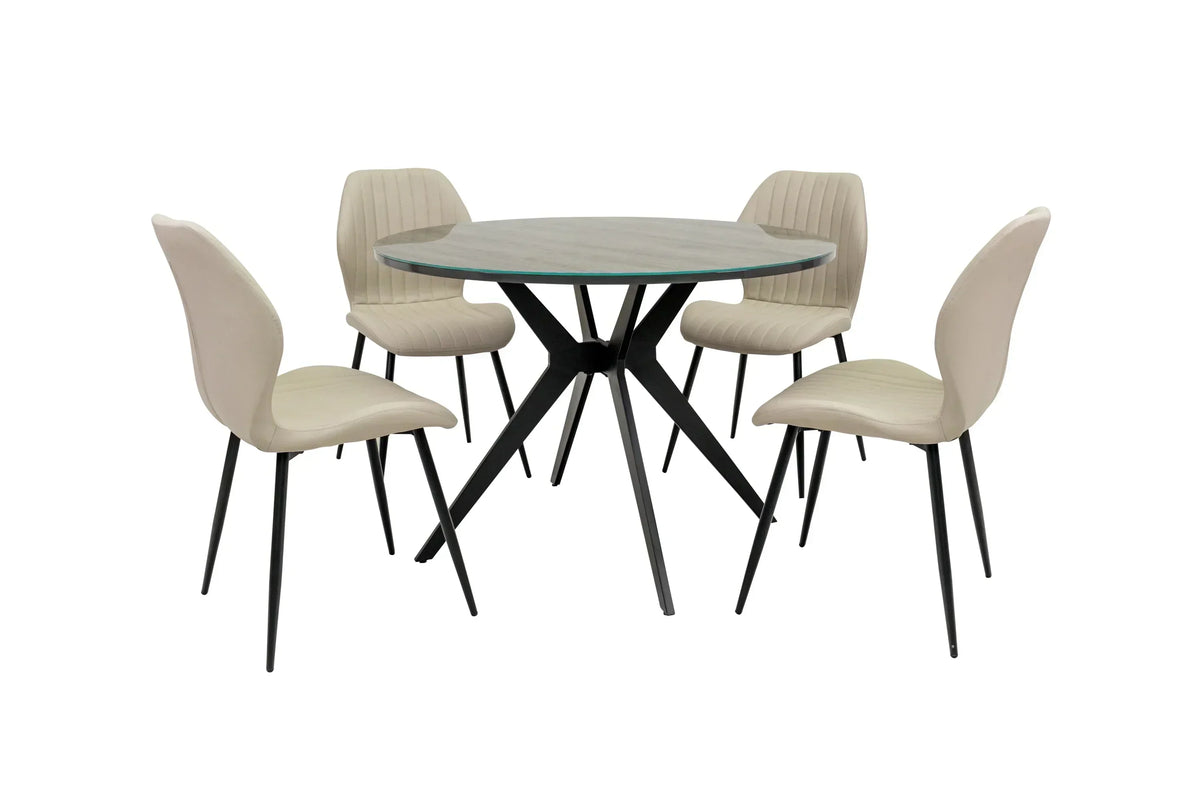 Round glass dining table set with four beige upholstered chairs and black metal legs