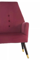Wine velvet accent chair with button detail and gold-tipped wooden legs, partial side view