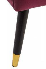Wine velvet chair leg with black finish and gold tip detail