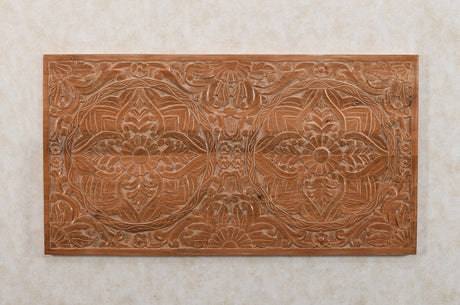 Handcrafted mango wood bedframe with intricate artwork detailing