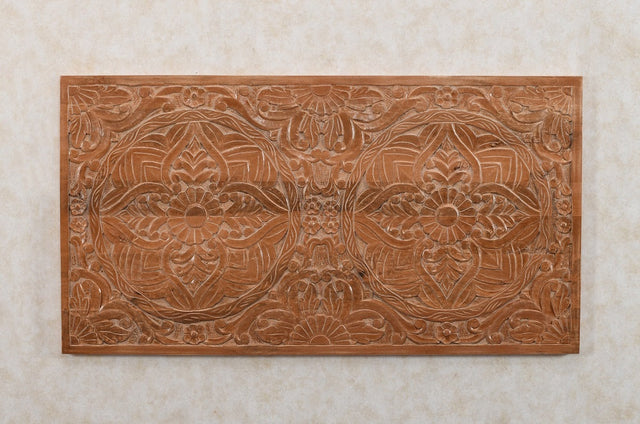 Handcrafted mango wood bedframe with intricate artwork detailing
