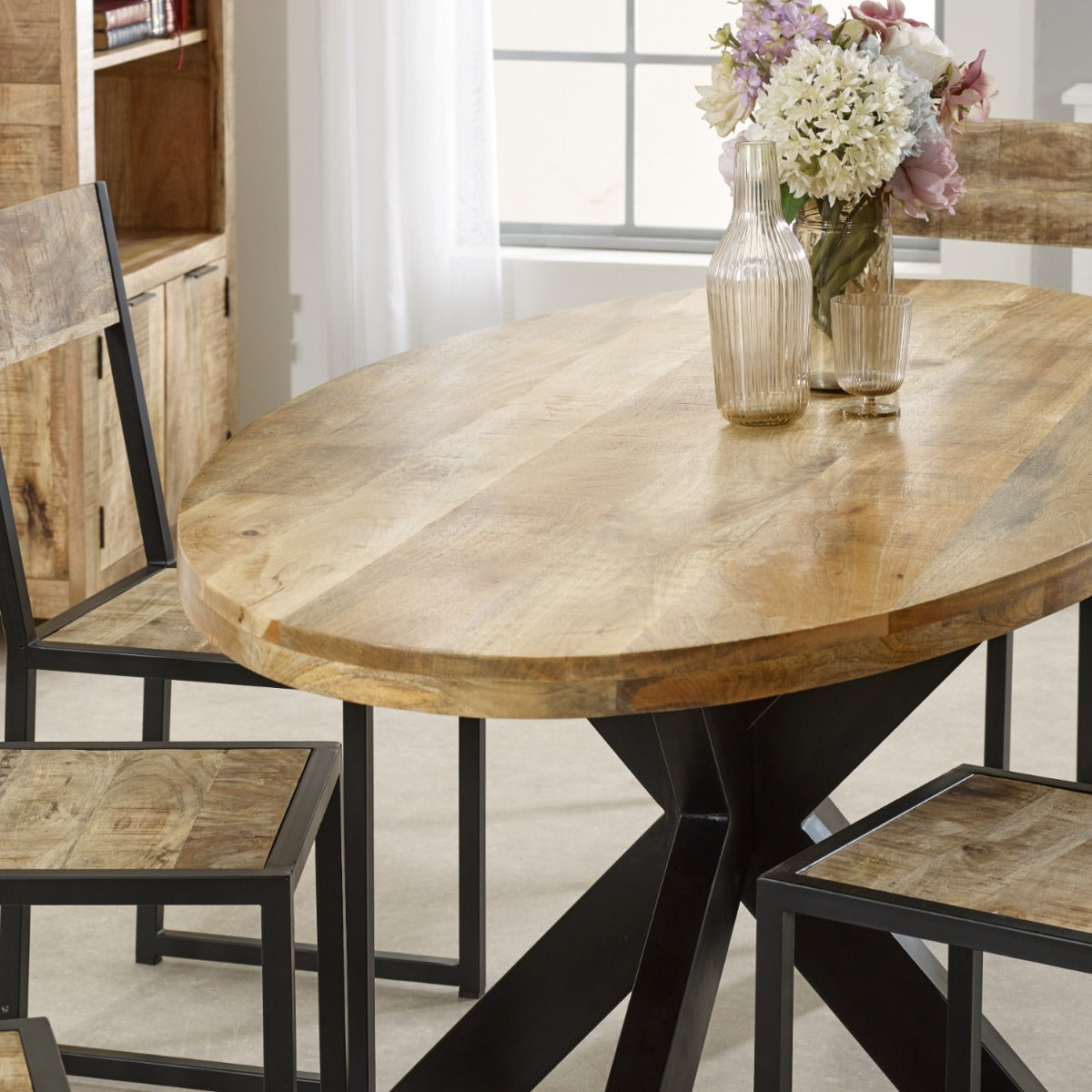 Surrey solid wood oval dining table with metal legs, rustic style