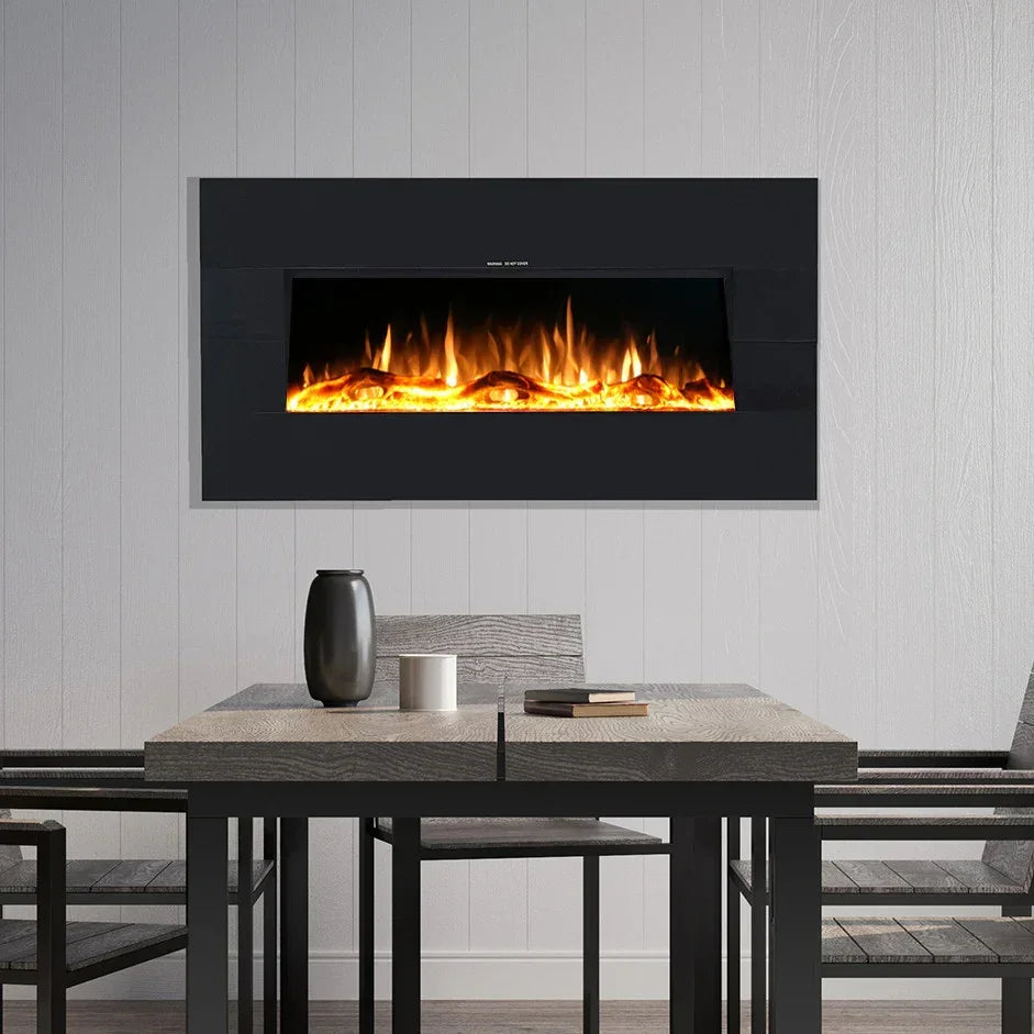 Modern dining table with benches and a wall mounted electric fireplace with flame effect