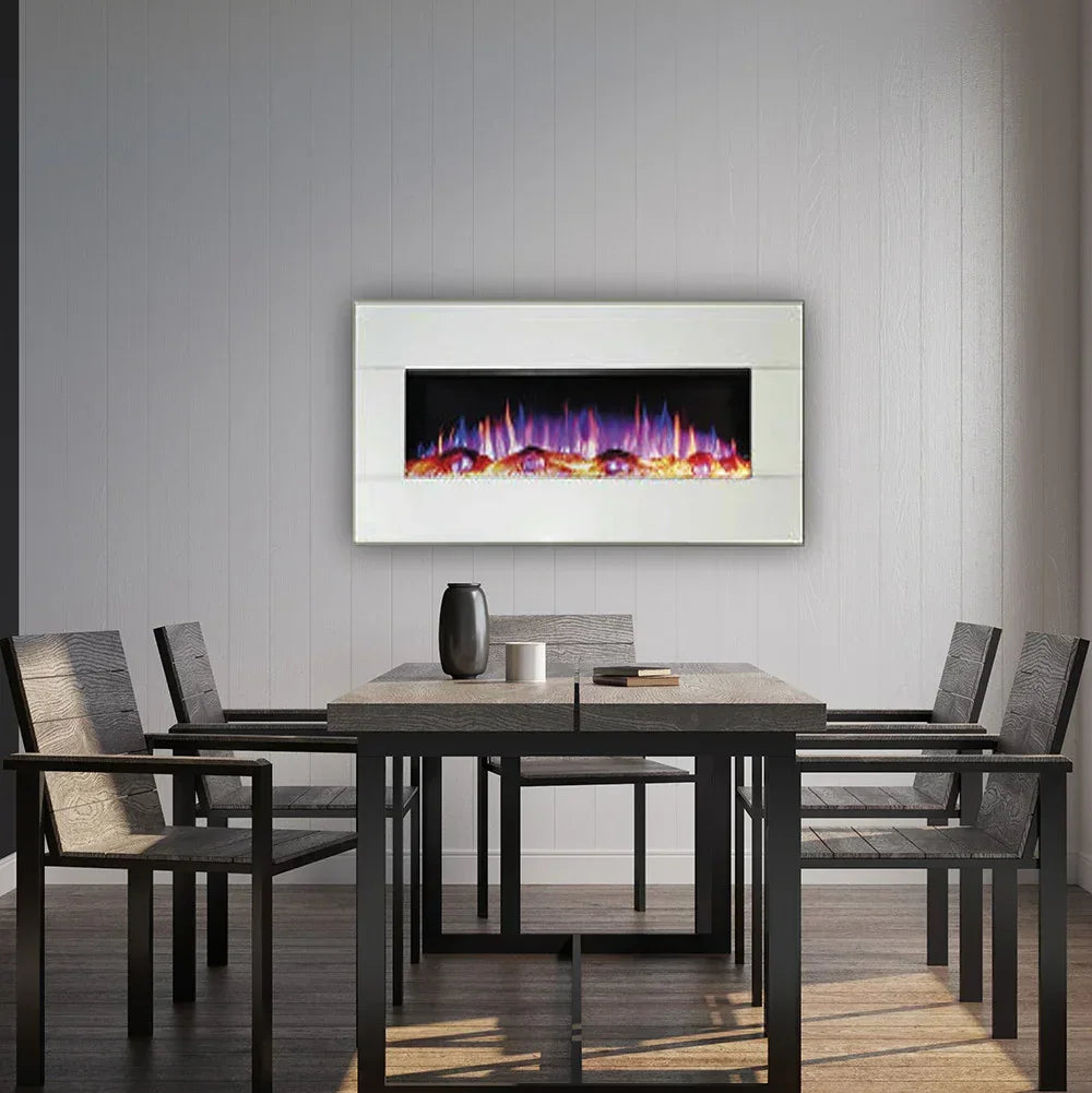 White wall mounted electric fireplace with colored flames above dining table and chairs