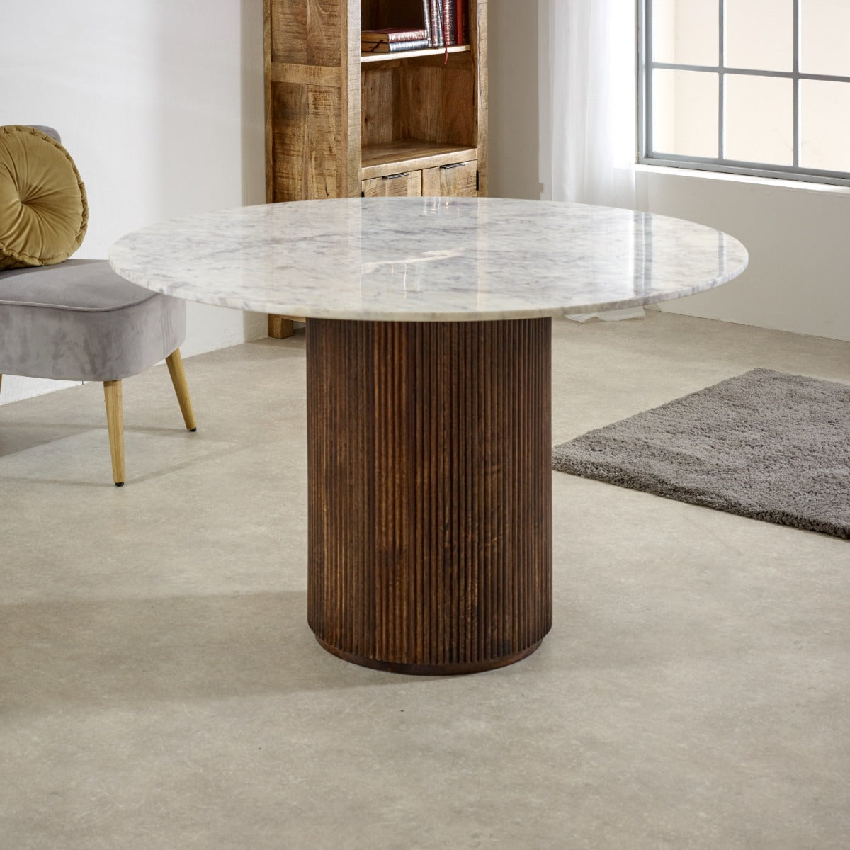 Round Opal dining table with mango wood pedestal and marble top