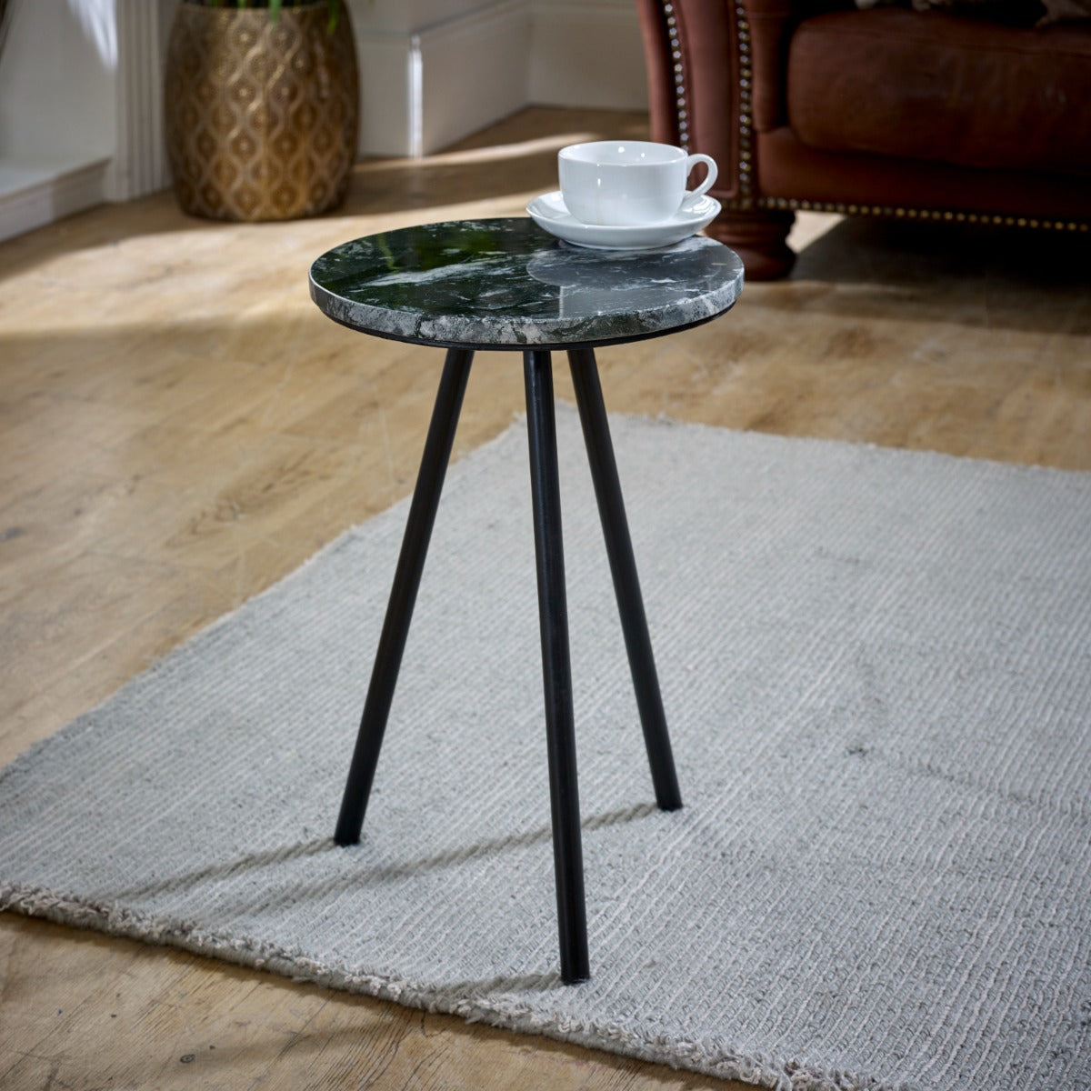 Opal side table with black marble top and metal legs, minimalist design