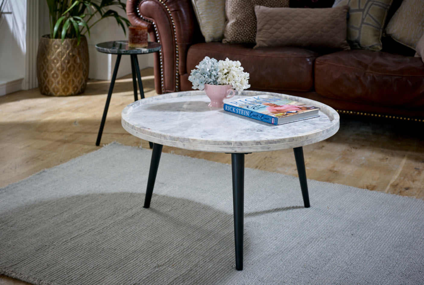 Ashford natural marble and wood pedestal coffee table in elegant taupe finish