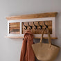 Handcrafted mango wood coat hanger with a whiteish finish