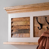 Handcrafted mango wood coat hanger with a whiteish finish