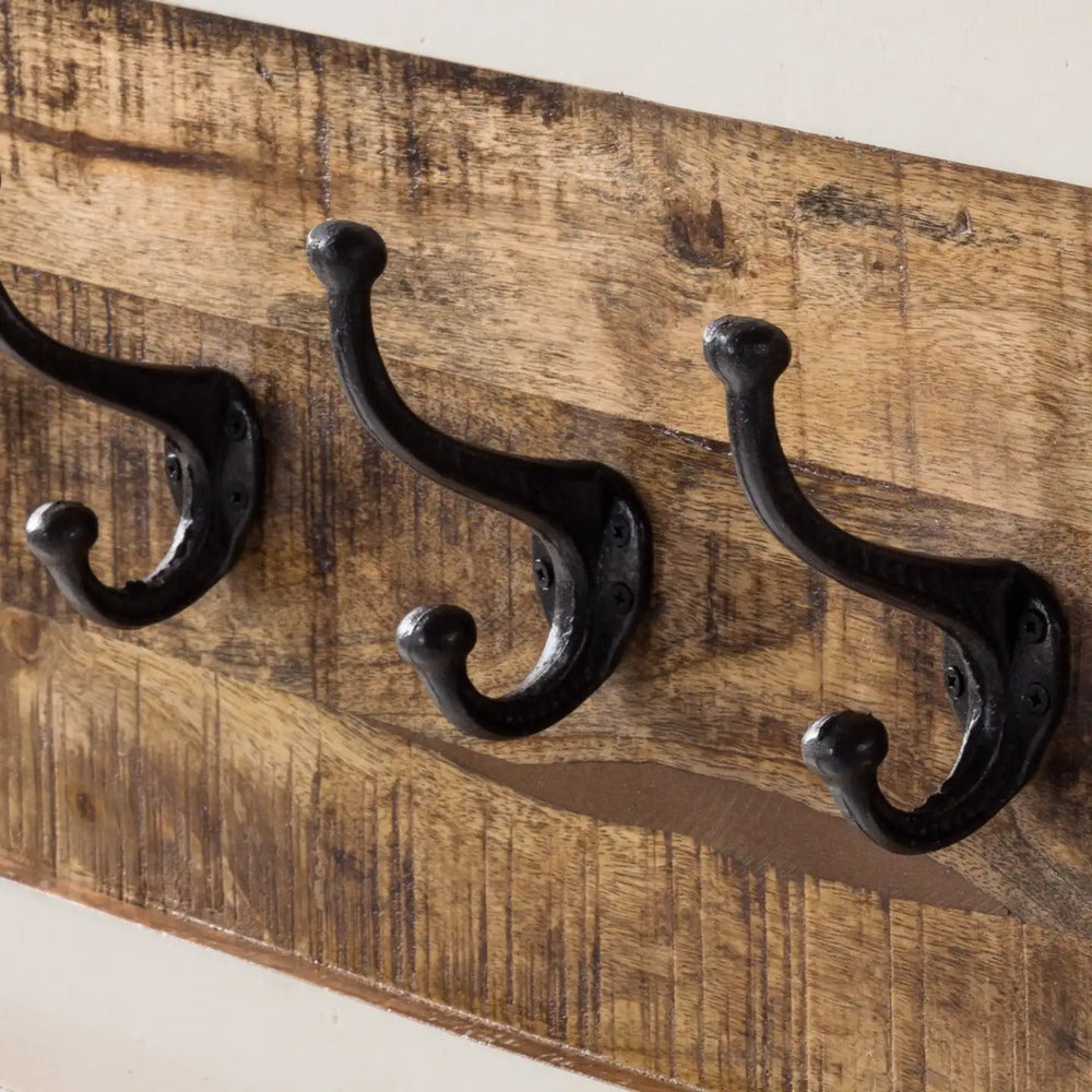 Handcrafted mango wood coat hanger with a whiteish finish