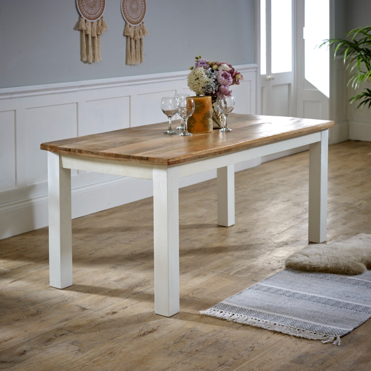 Alfie Dining Table made of solid mango wood with a whiteish finish