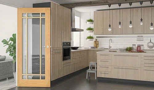 Bevelled oak glazed door installed in modern kitchen with light wood cabinets