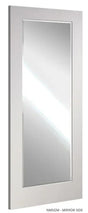 Rectangular wall mirror with white frame and reflective glass, side view
