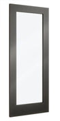 Tall rectangular wall mirror with black frame reflecting minimal light