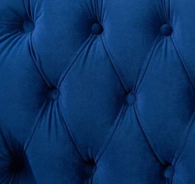 Blue velvet sofa upholstery with deep button tufting detail