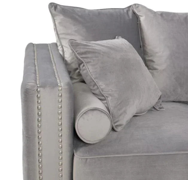 Grey velvet sofa with pearl studded armrest and matching scatter cushions