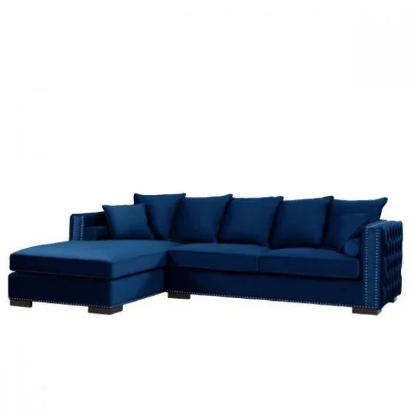 Blue velvet corner sofa with chaise and stud detailing, five back cushions and square arms