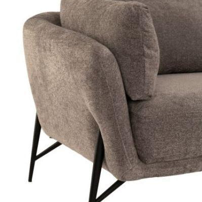 Corner view of grey fabric sofa with black metal legs and plush seat cushion