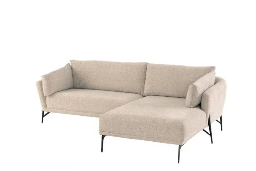 Beige corner sofa with fabric upholstery and slim black legs on white background