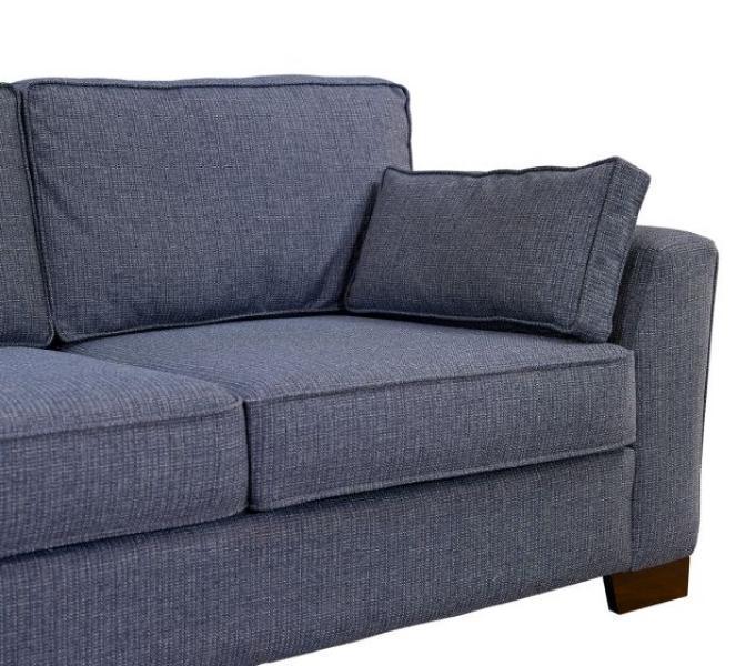 Blue fabric sofa with wooden legs and matching scatter cushion, corner angle view
