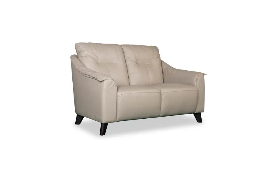 Beige leather two seater sofa with padded cushions and dark wooden legs