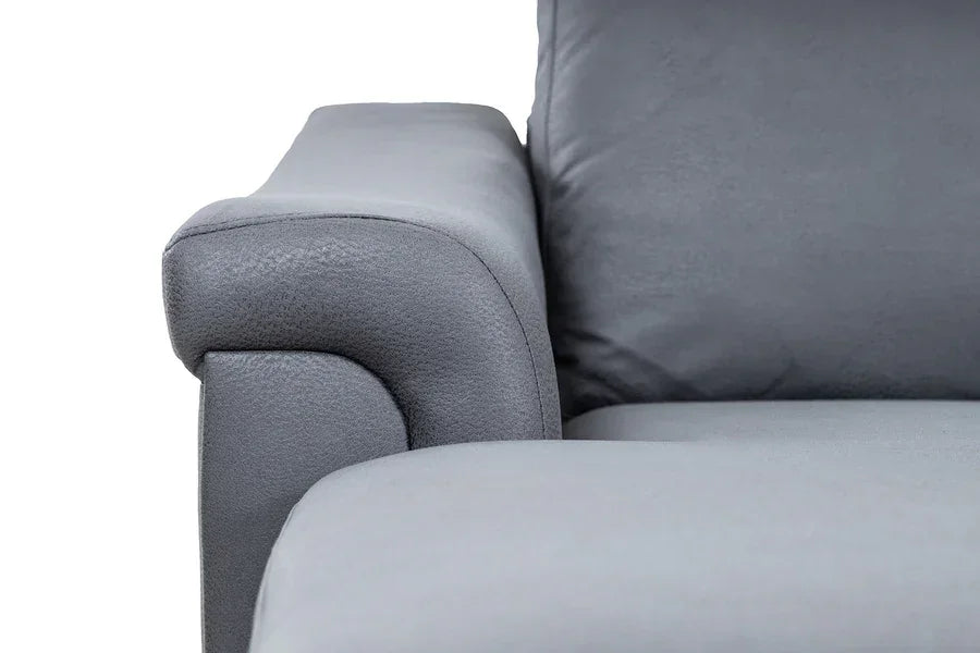 Close-up of grey fabric sofa armrest and seat cushion