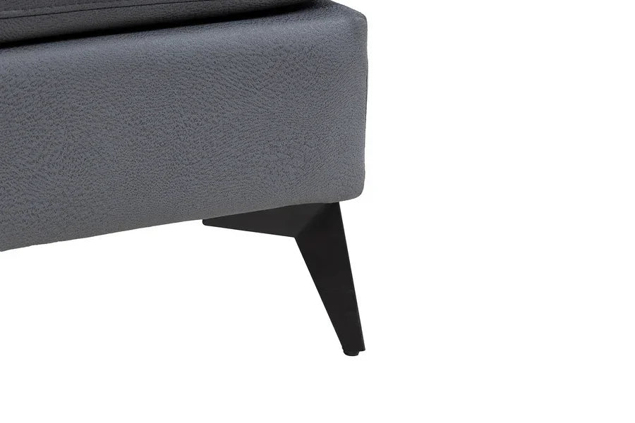 Close-up of grey fabric sofa corner with black metal leg