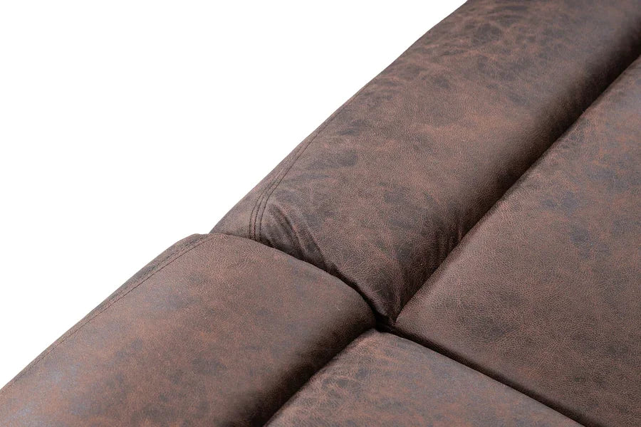 Close-up of brown faux leather sofa cushion with textured finish