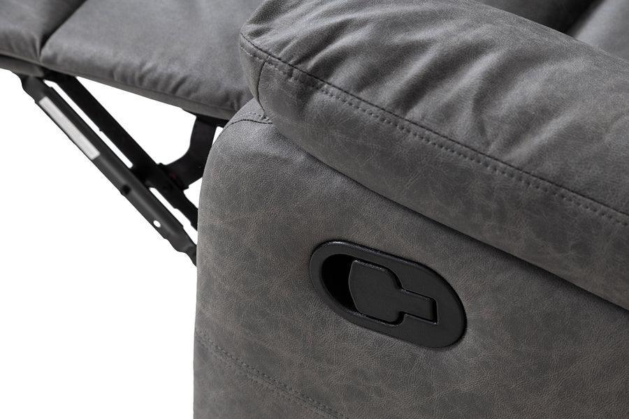 Close view of grey recliner sofa arm with manual reclining lever and stitched upholstery